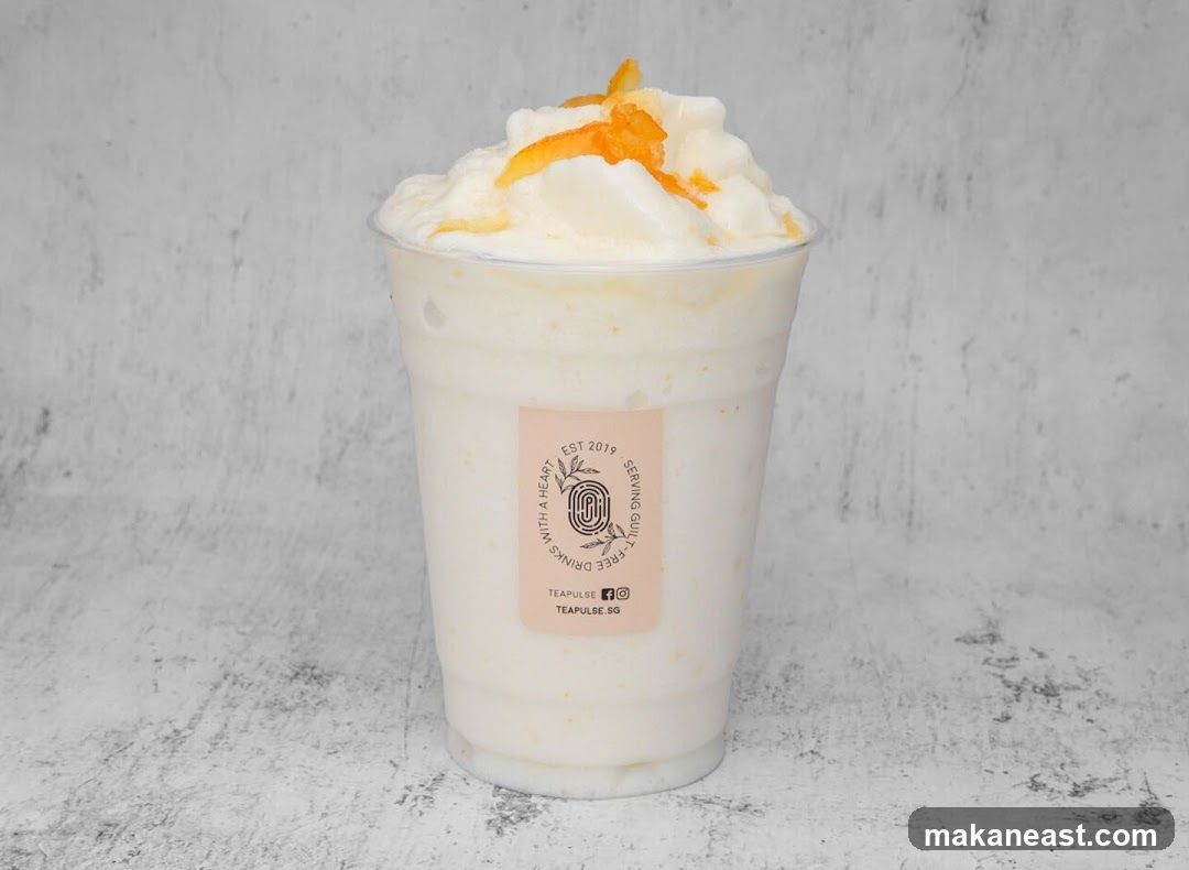 Creamy Drink with Orange Garnish