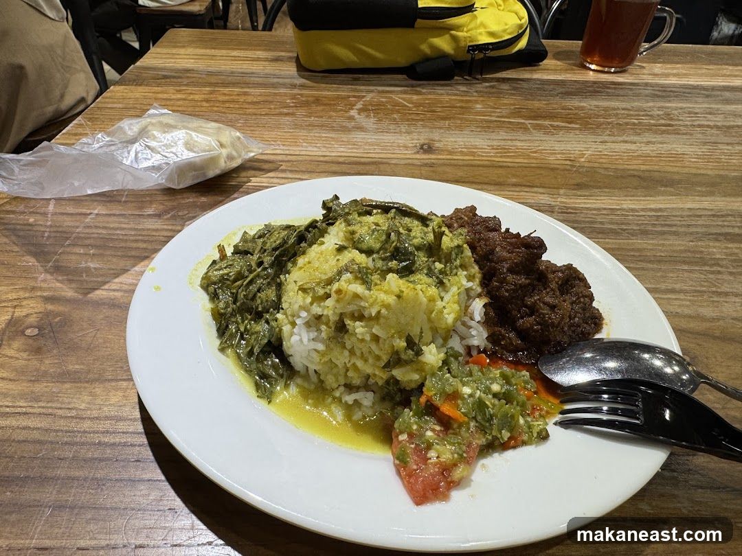 Plate of food with rice and side dishes