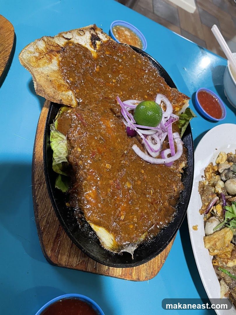 Sizzling Fish Dish with Accompaniments