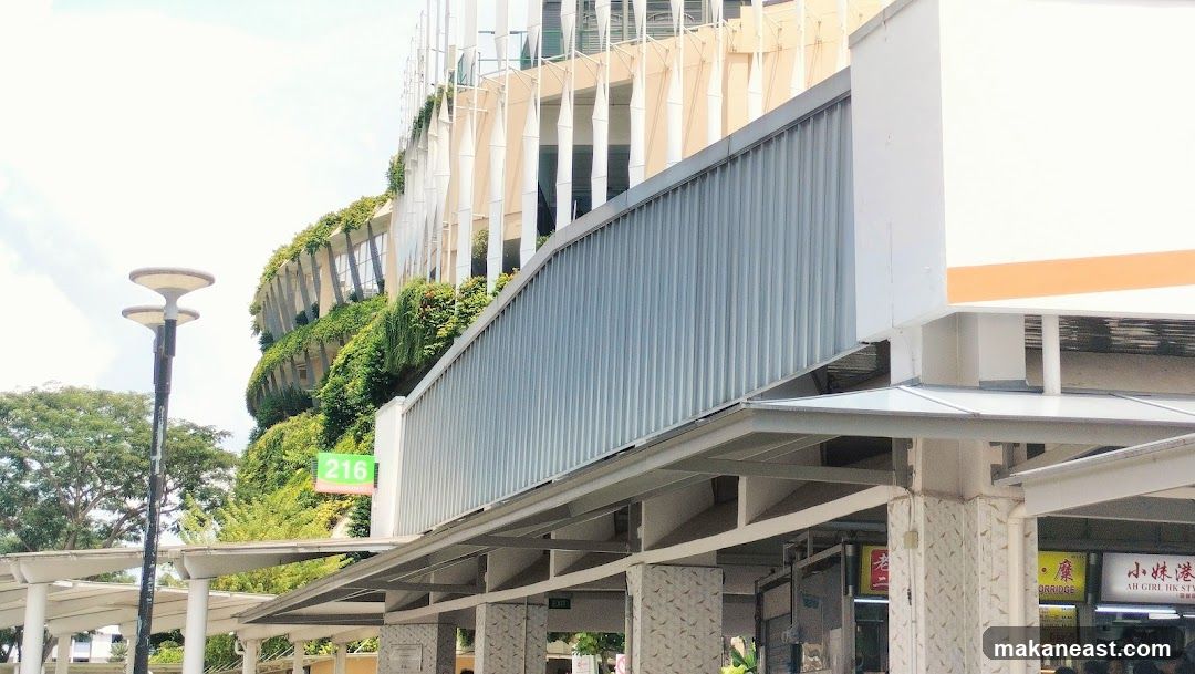 Modern Building with Greenery and Signage