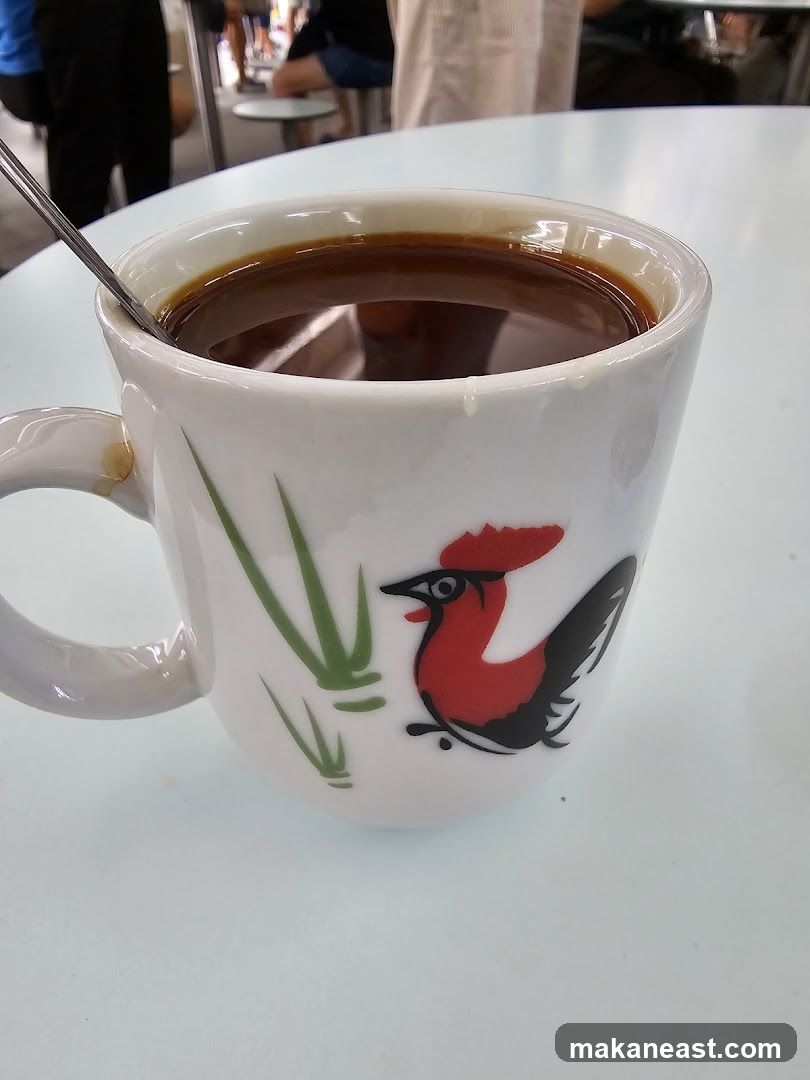 Coffee in a mug with a rooster design
