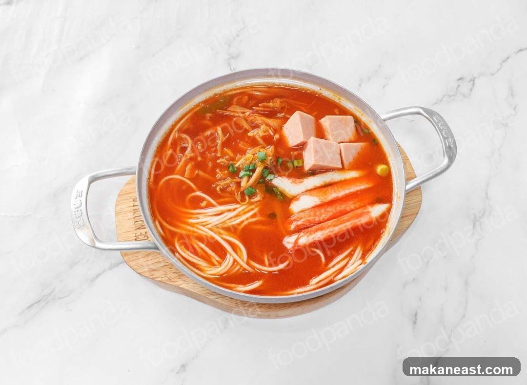 Spicy Noodle Soup with Ham and Crab Sticks