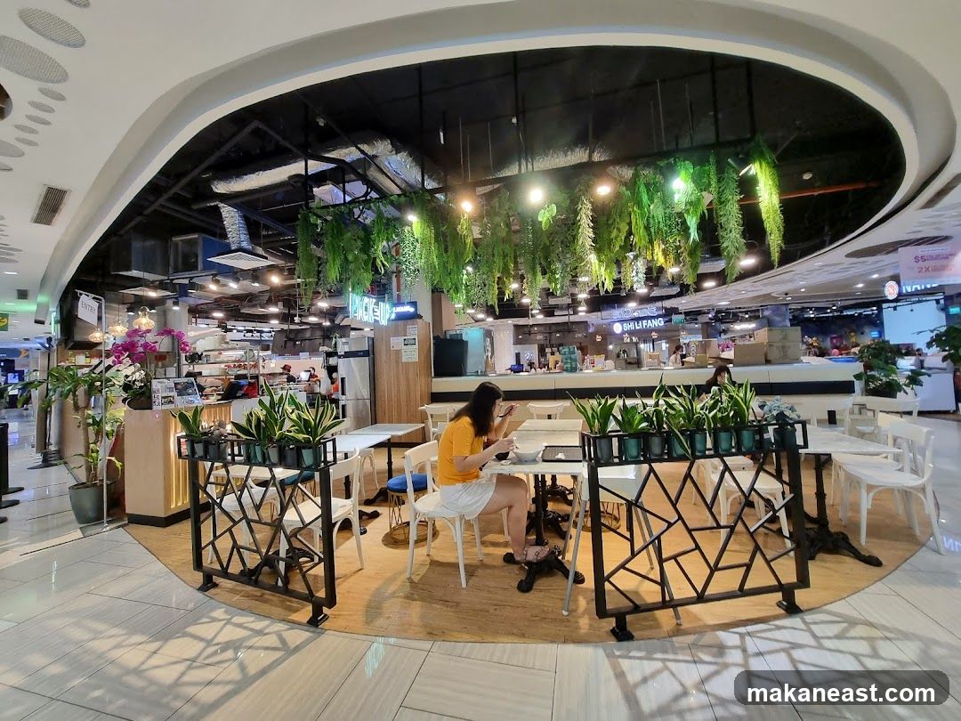 Indoor dining area with plants and seating