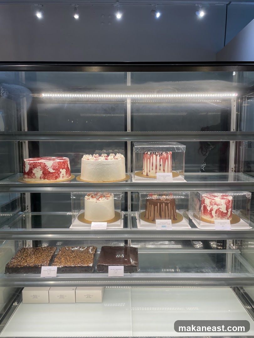 Cakes and Brownies in a Display Case