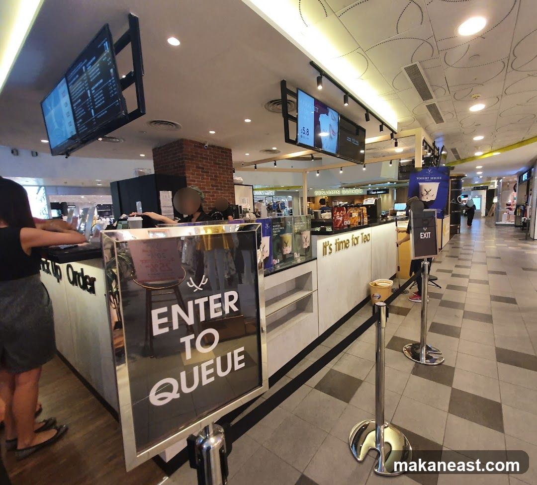 Tea shop counter with queue signs