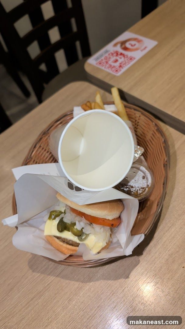 Burger meal with fries and drink cup