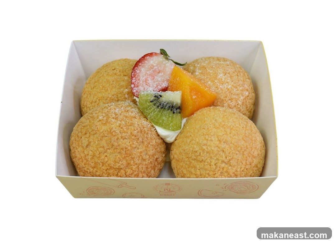 Four Cream Puffs with Fruit Topping
