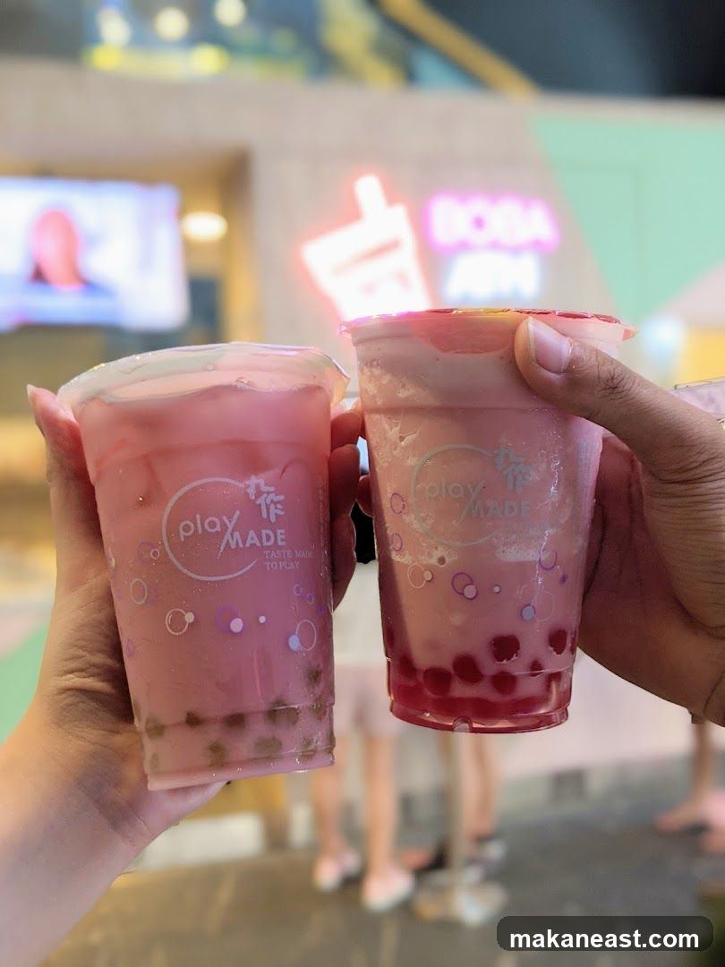 Two pink bubble tea drinks