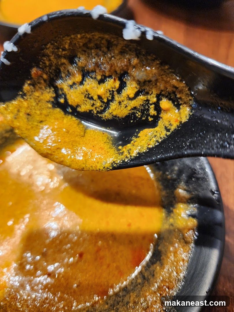 Close-up of curry sauce on a spoon
