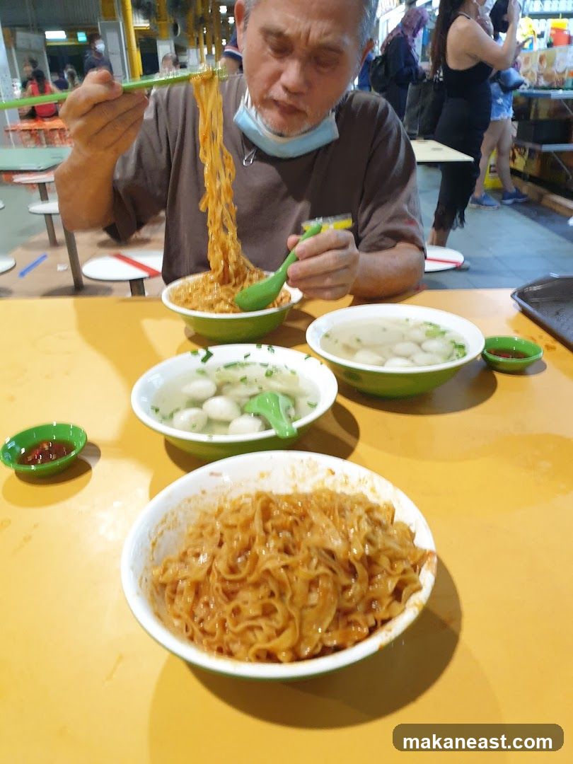 Man eating noodles
