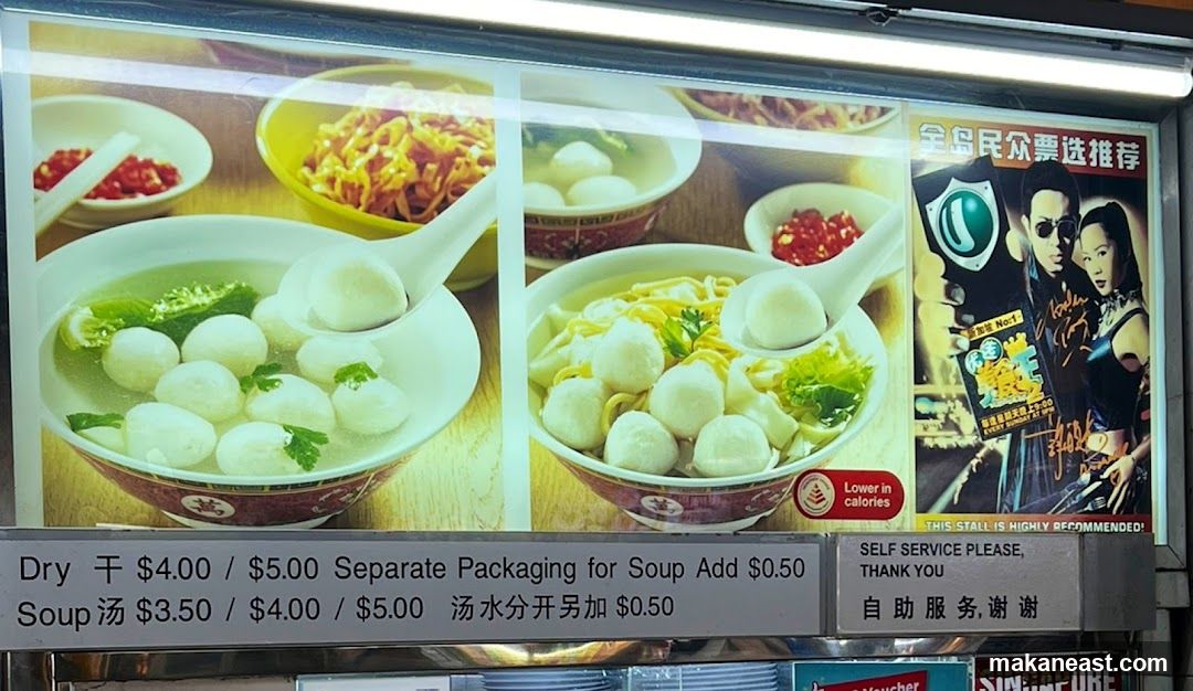 Food stall display with menu and promotional poster