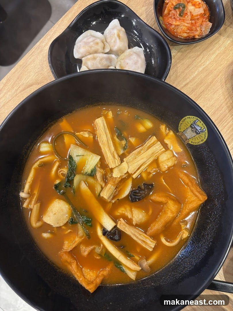 Spicy Noodle Soup with Dumplings and Kimchi