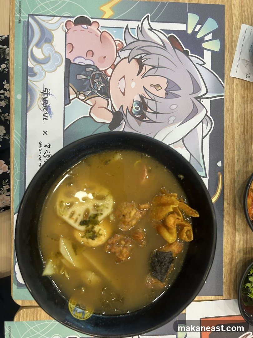 Bowl of soup with anime placemat