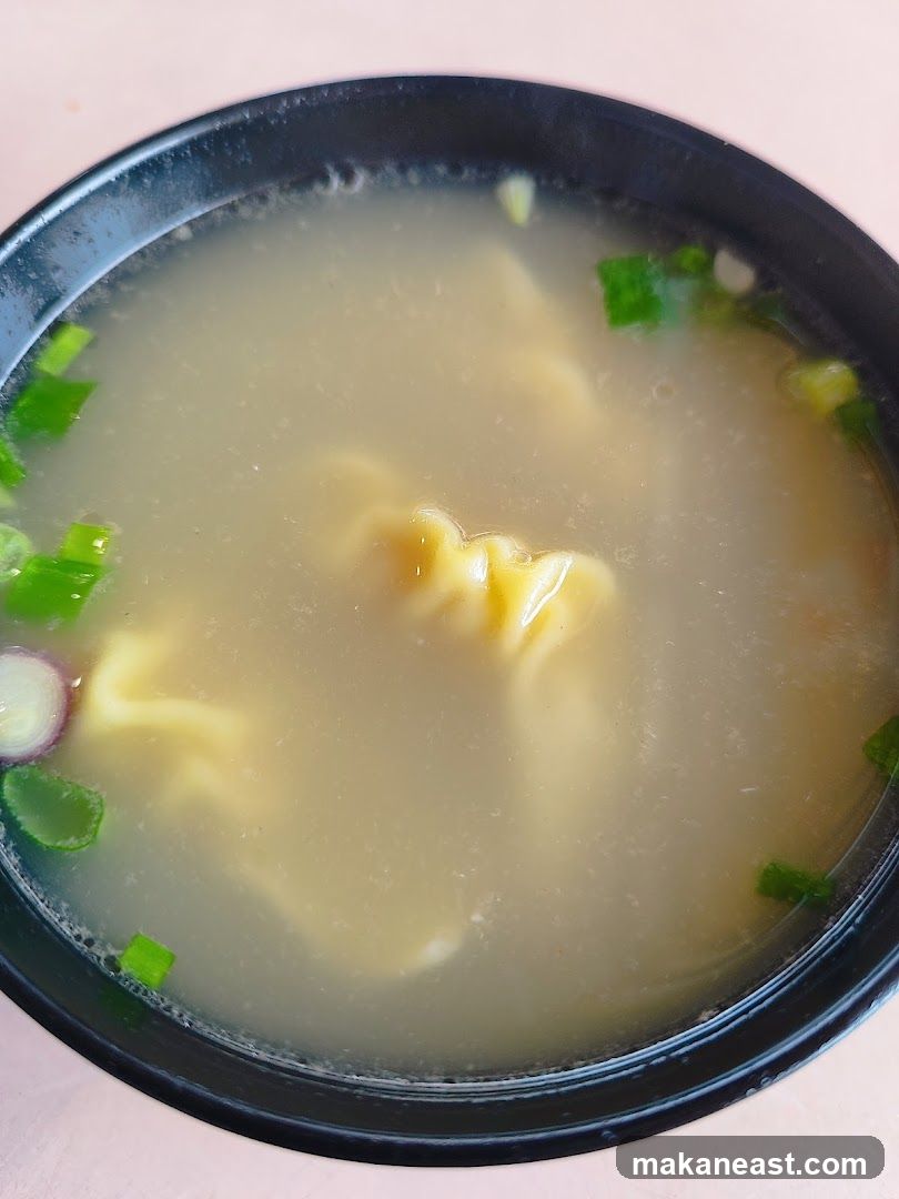 Bowl of Soup with Dumplings