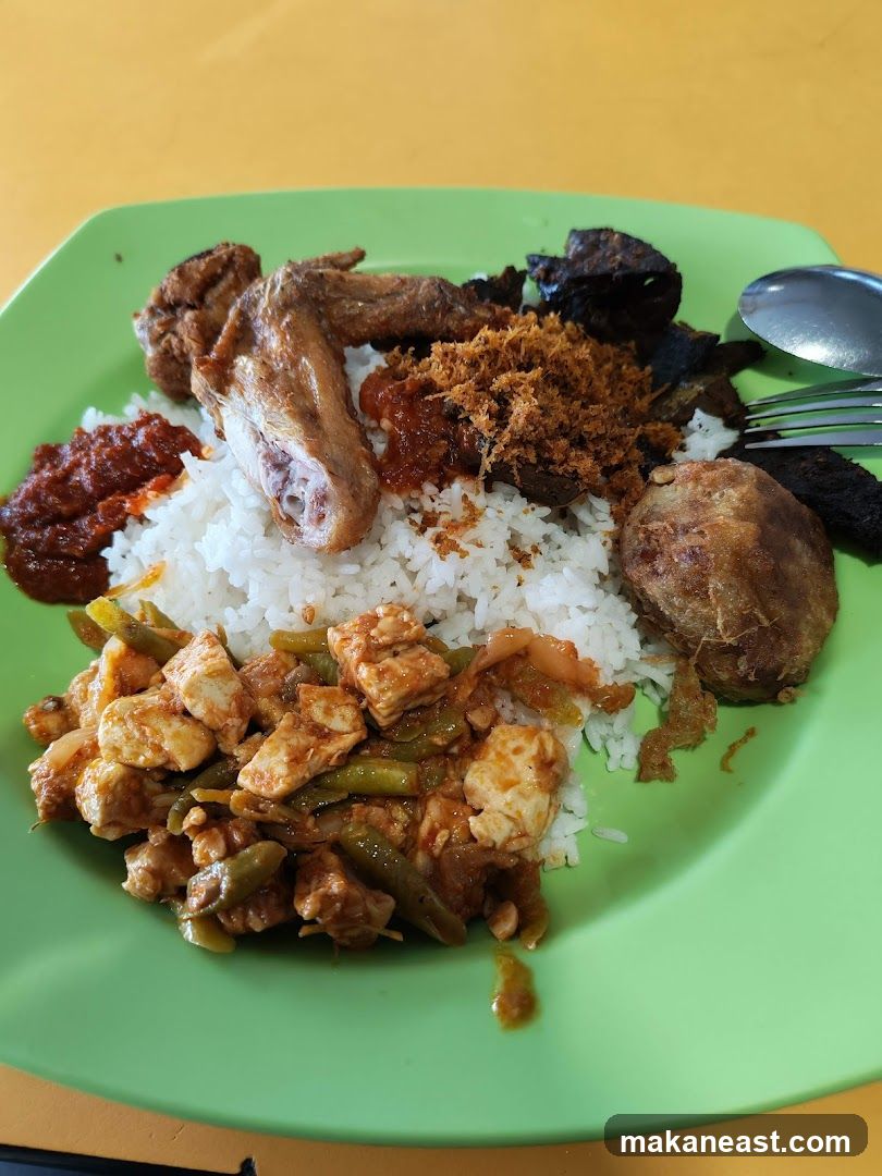 Plate of rice with various side dishes