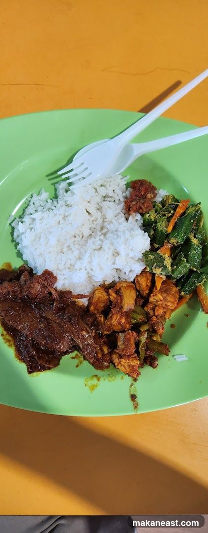 Plate of food with rice and side dishes