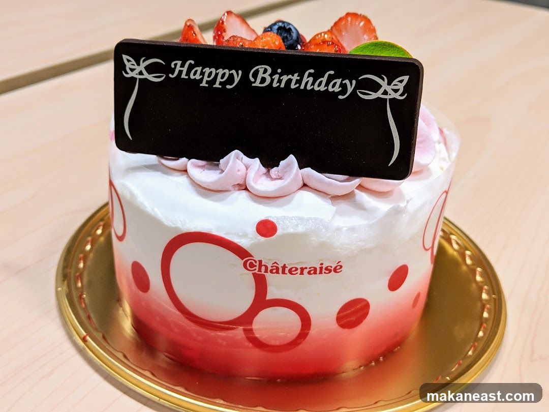 Birthday Cake with Fruit and Chocolate Plaque