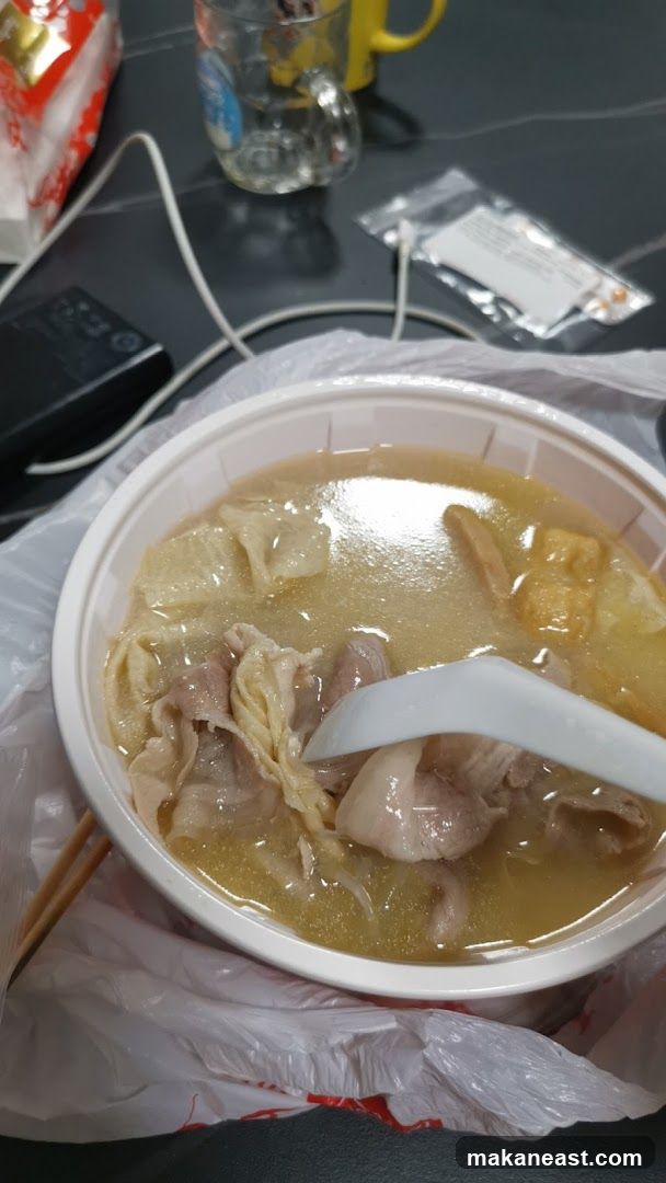 Bowl of soup with meat and tofu skin