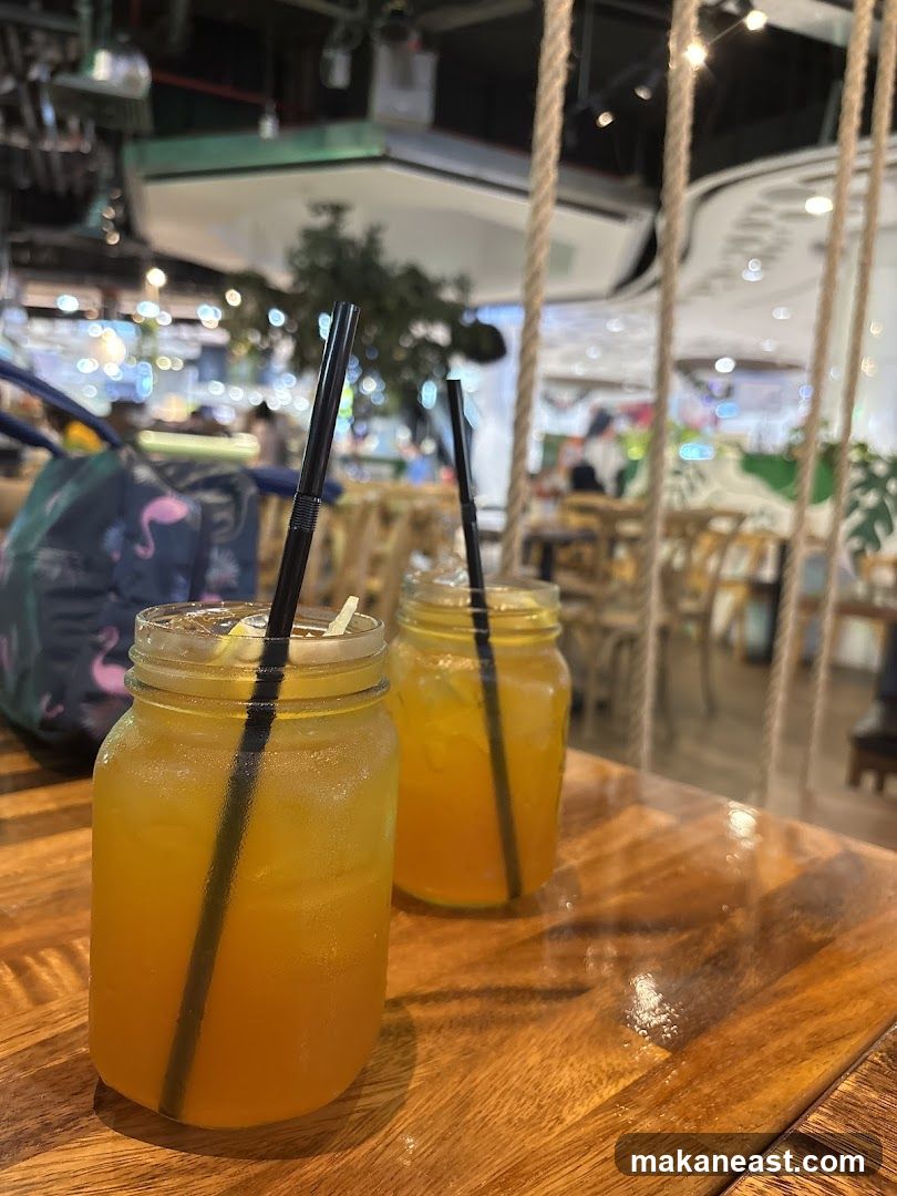 Two Iced Drinks on a Wooden Table