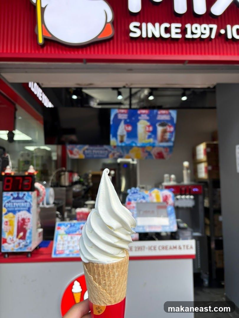 Ice Cream Cone in Front of Shop
