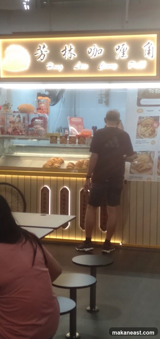Food stall with pastries and menu