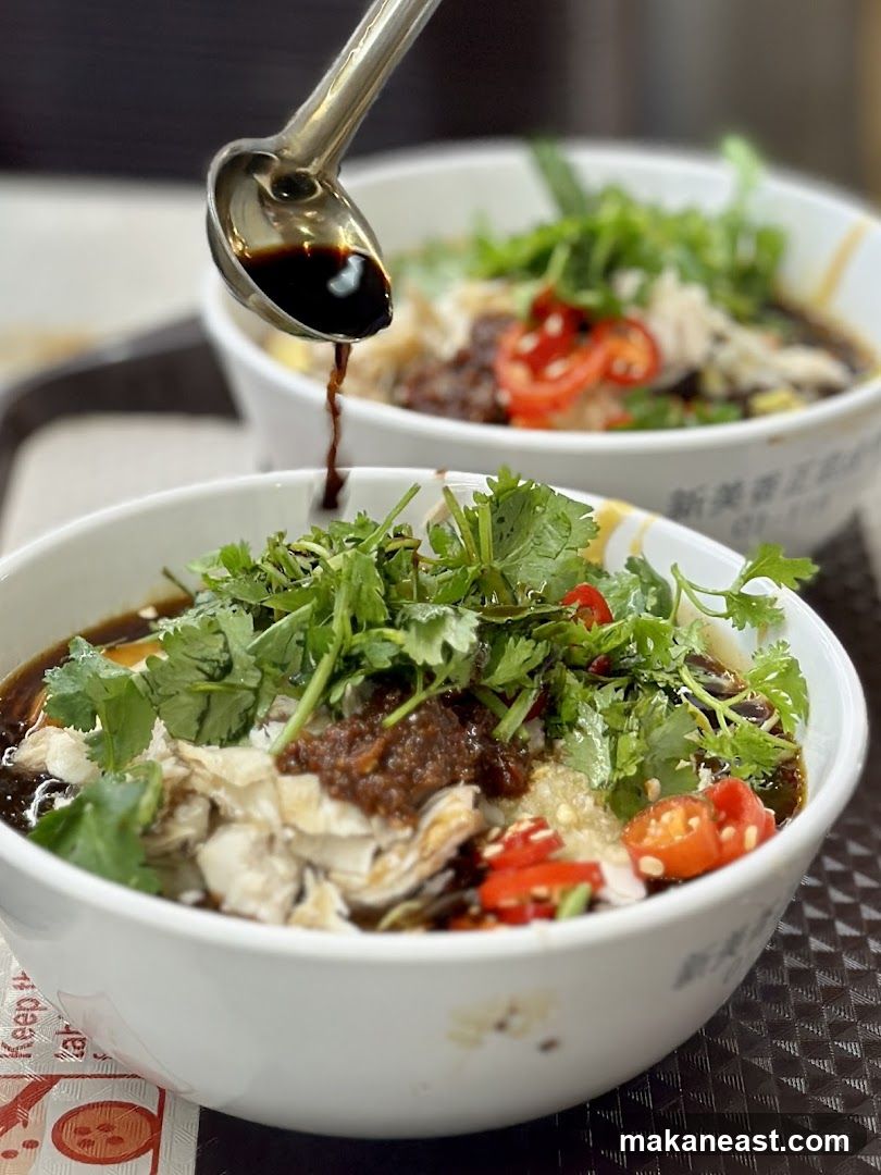 Adding Sauce to a Bowl of Food