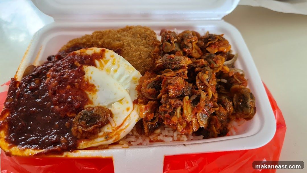 Rice dish with fried item and shellfish