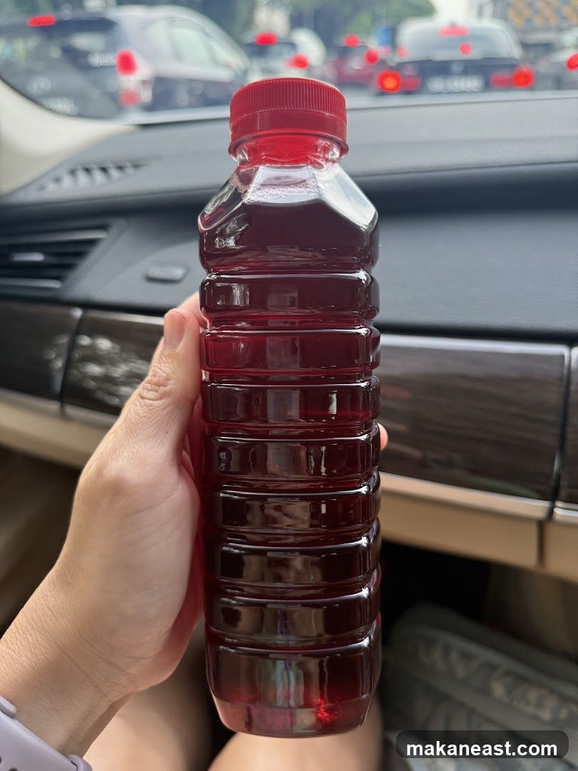 Bottle of Red Liquid