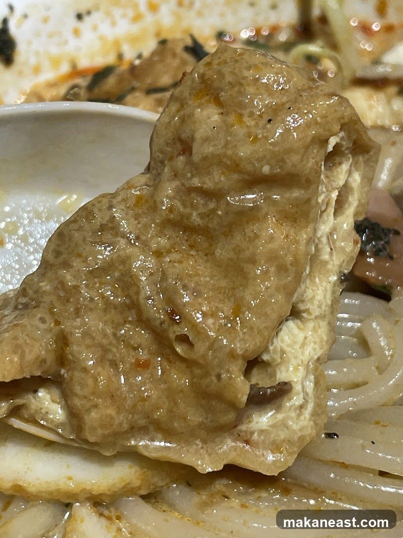 Close-up of Tofu Puff in Curry Noodles