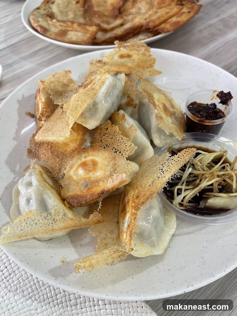 Pan-fried dumplings with dipping sauces