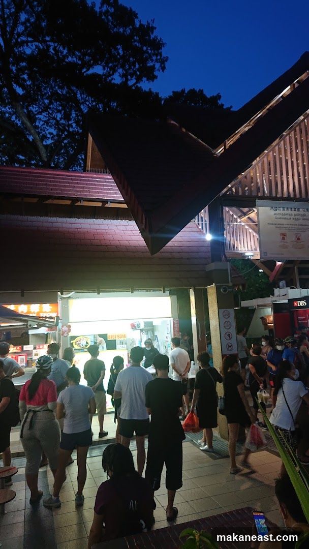 People queuing at a food stall