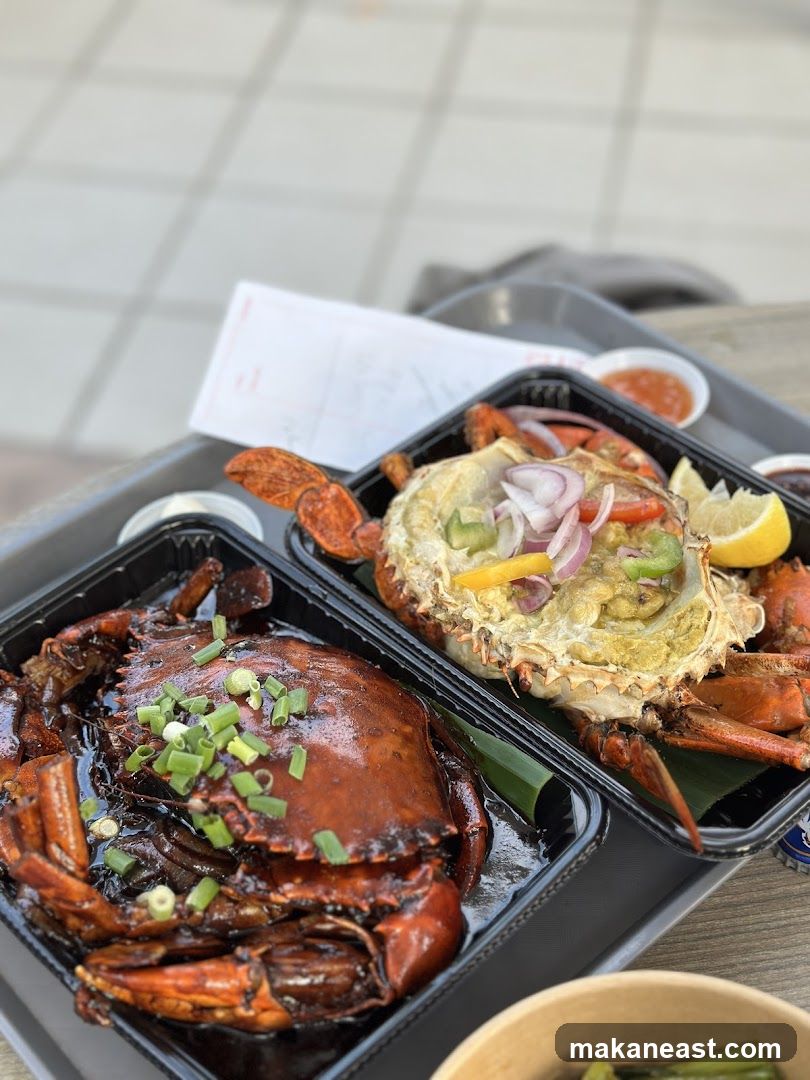 Two crabs in takeout containers
