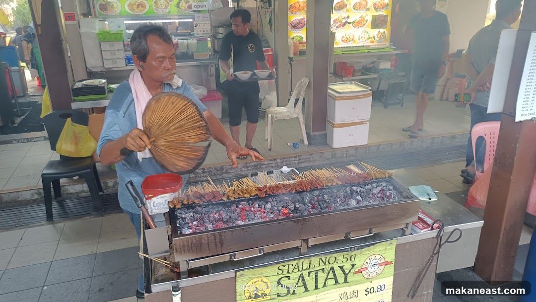 Man Fanning Satay Grill