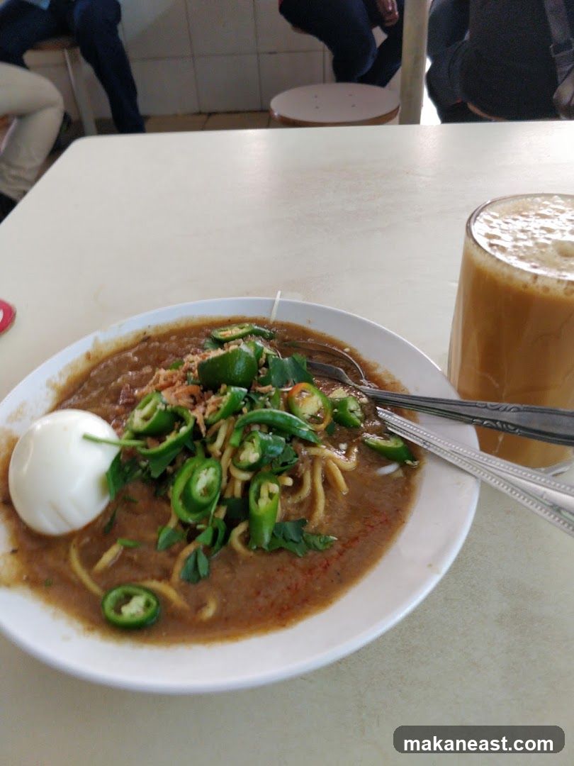 Noodle Dish with Egg and Drink