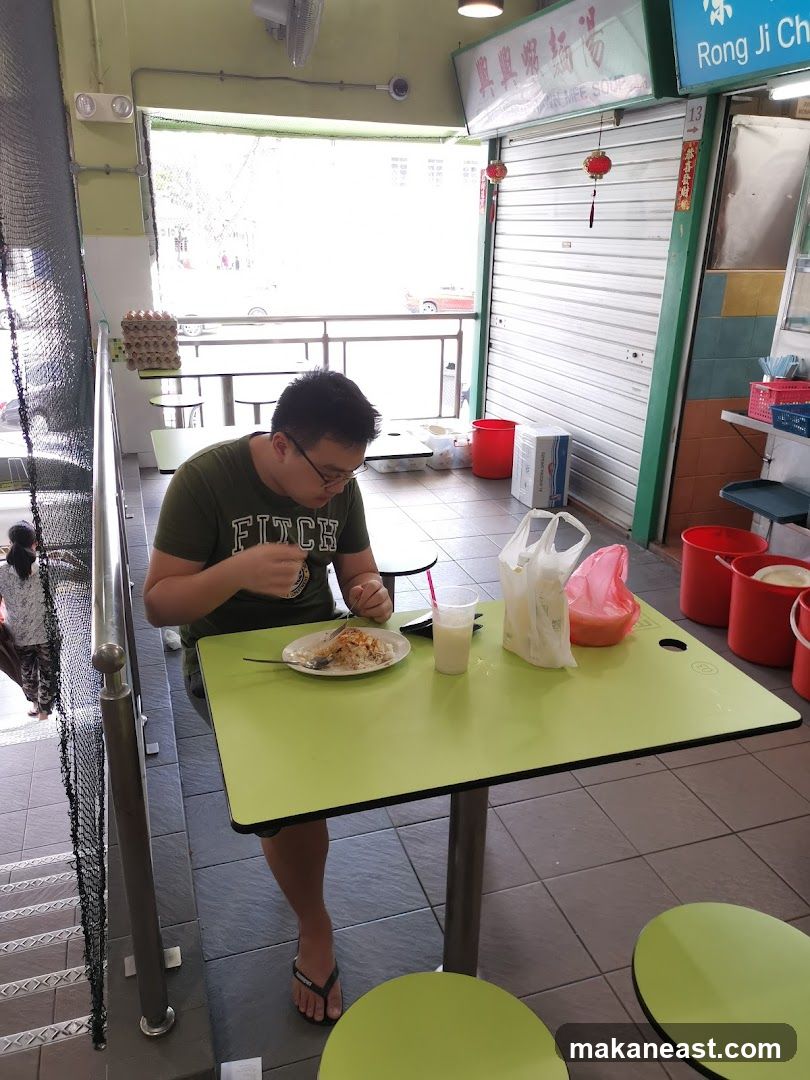 Man Eating at a Table