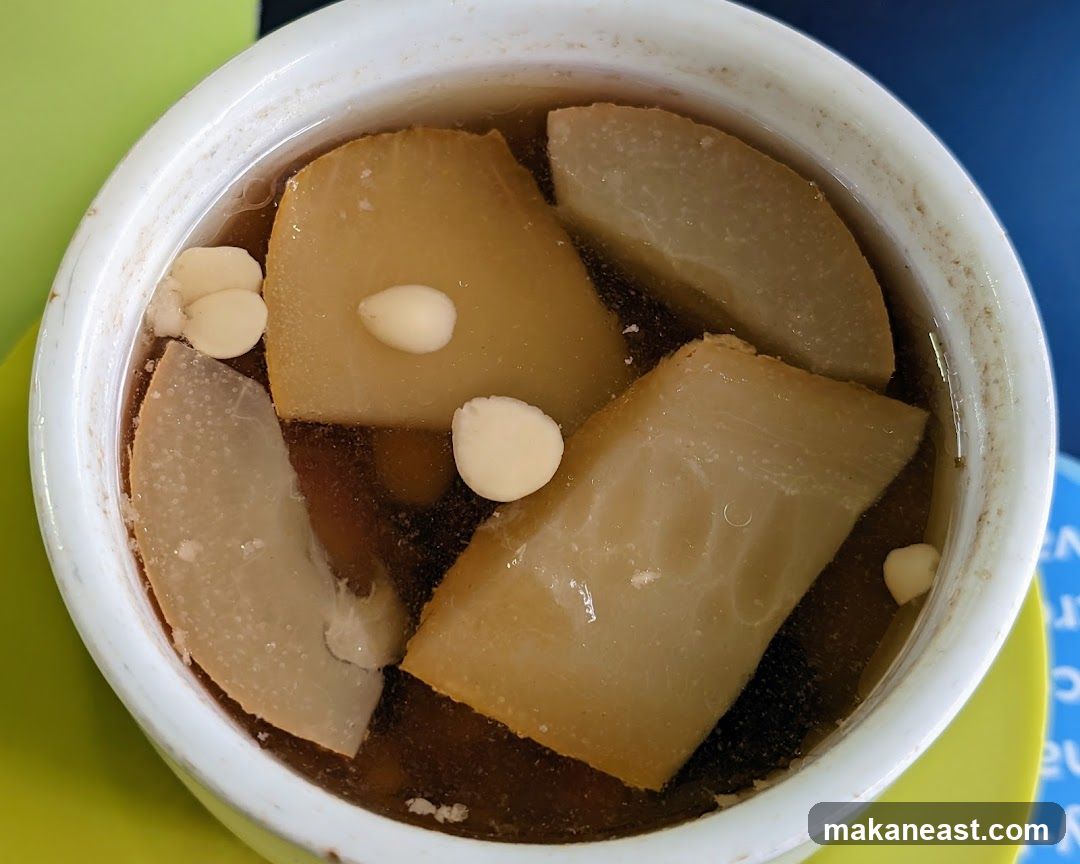 Bowl of Soup with Sliced Ingredients