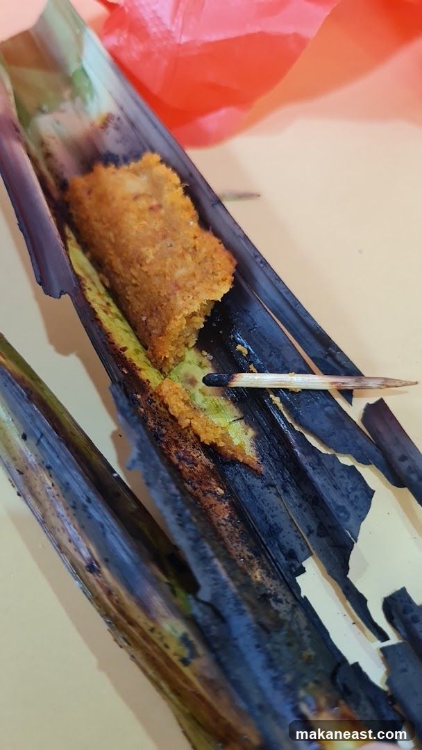 Food item wrapped in banana leaves