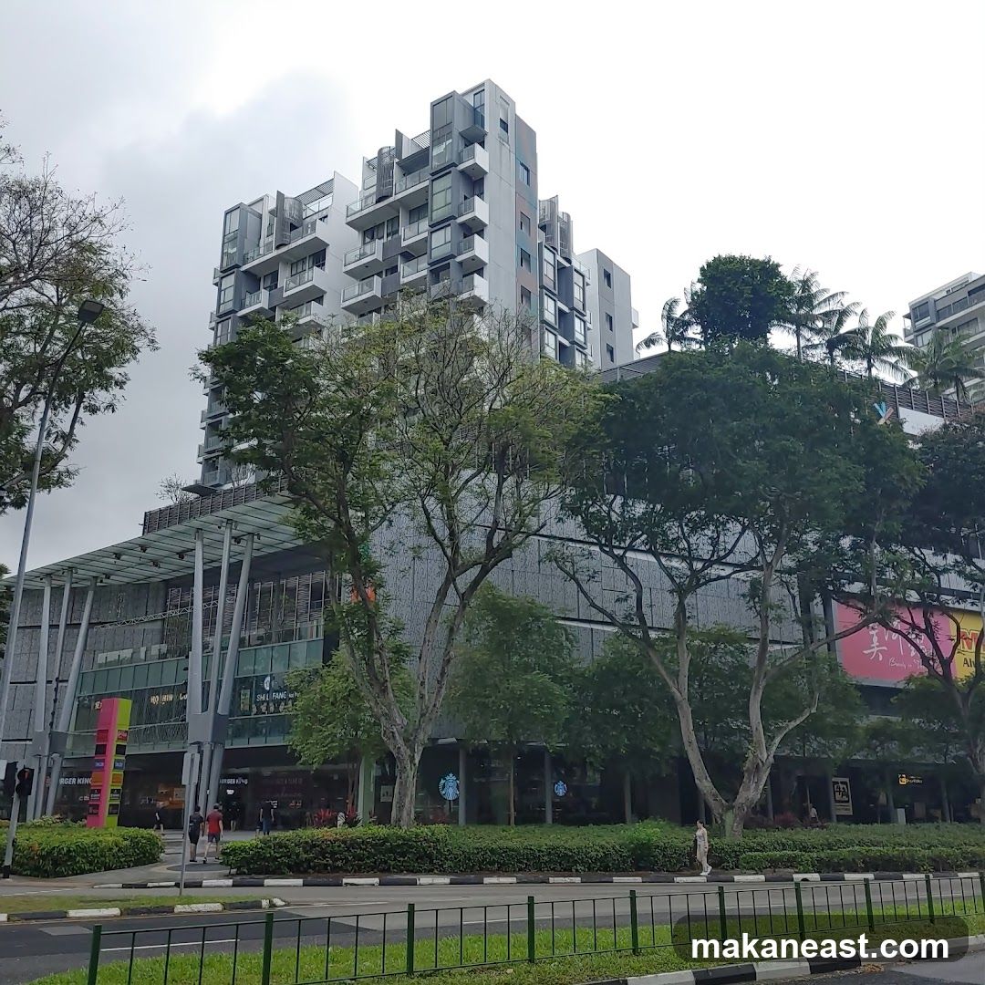 Modern Building with Shops and Trees