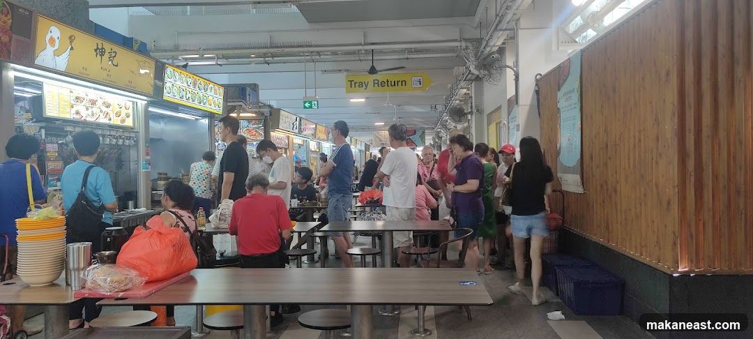 Busy food court with people queuing