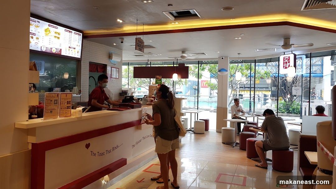 Interior of a cafe with customers and staff