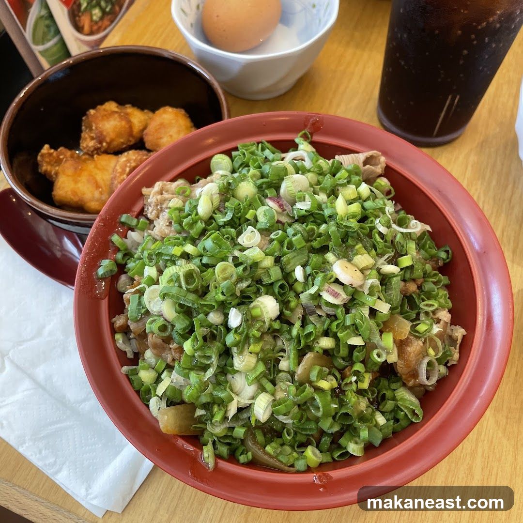 Donburi with green onions and fried chicken
