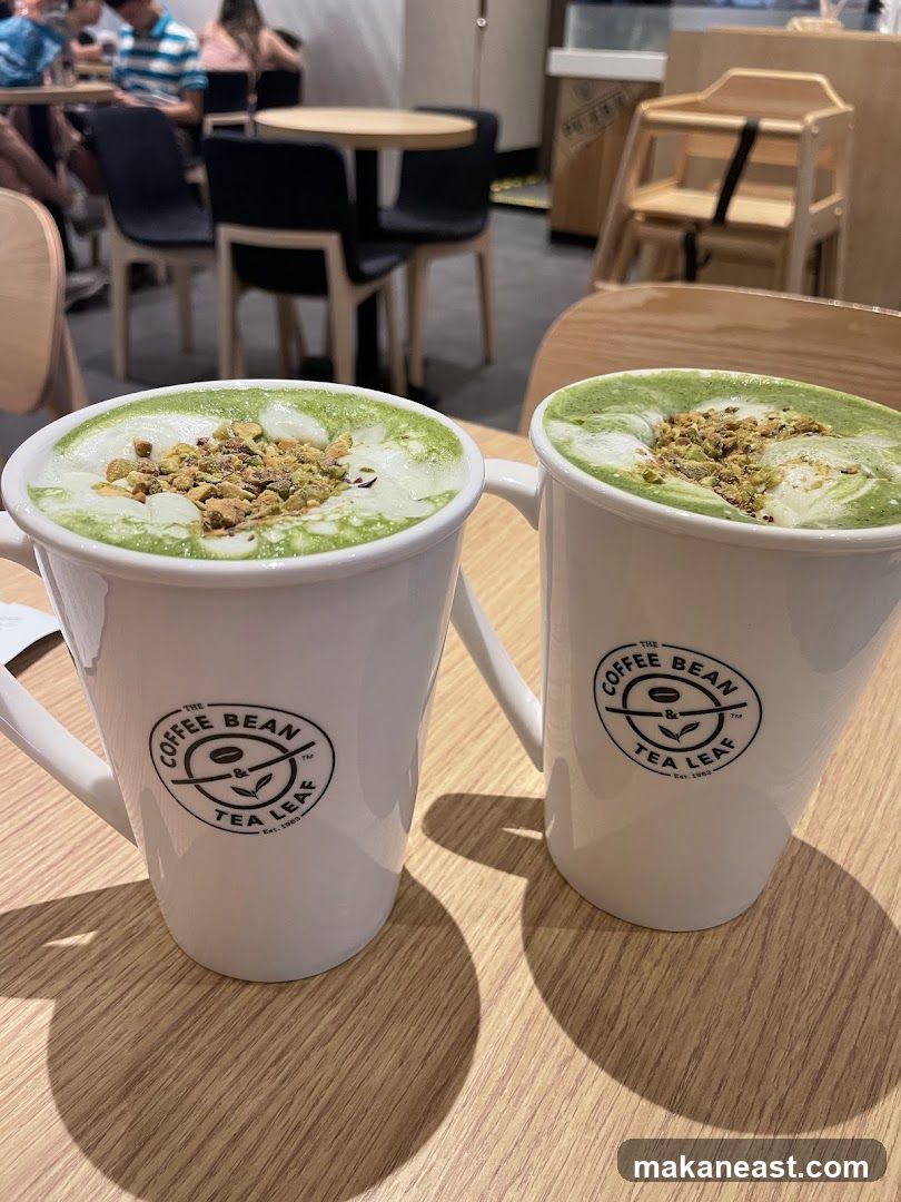 Two matcha lattes with pistachios