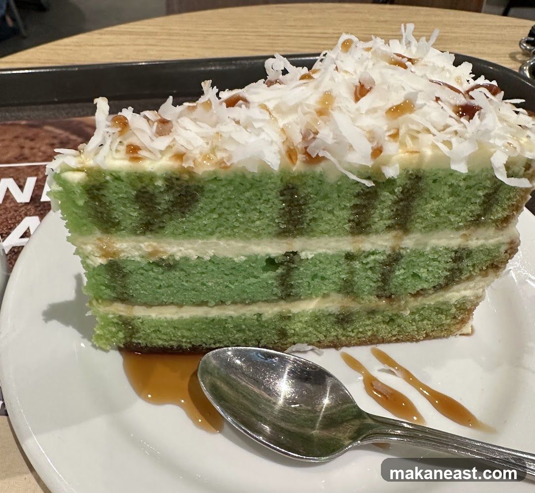 Slice of Green Layer Cake with Coconut and Caramel