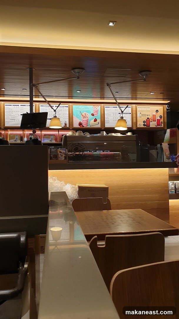 Coffee shop interior with menu boards and seating