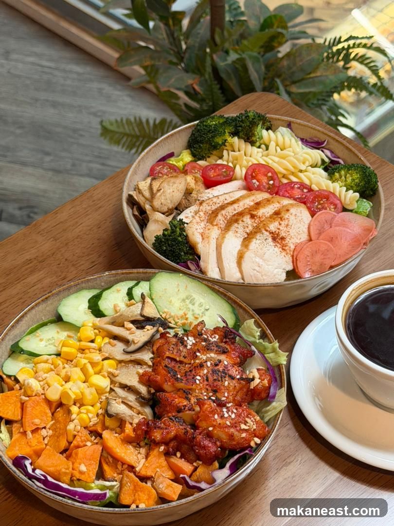 Two healthy salad bowls and a cup of coffee