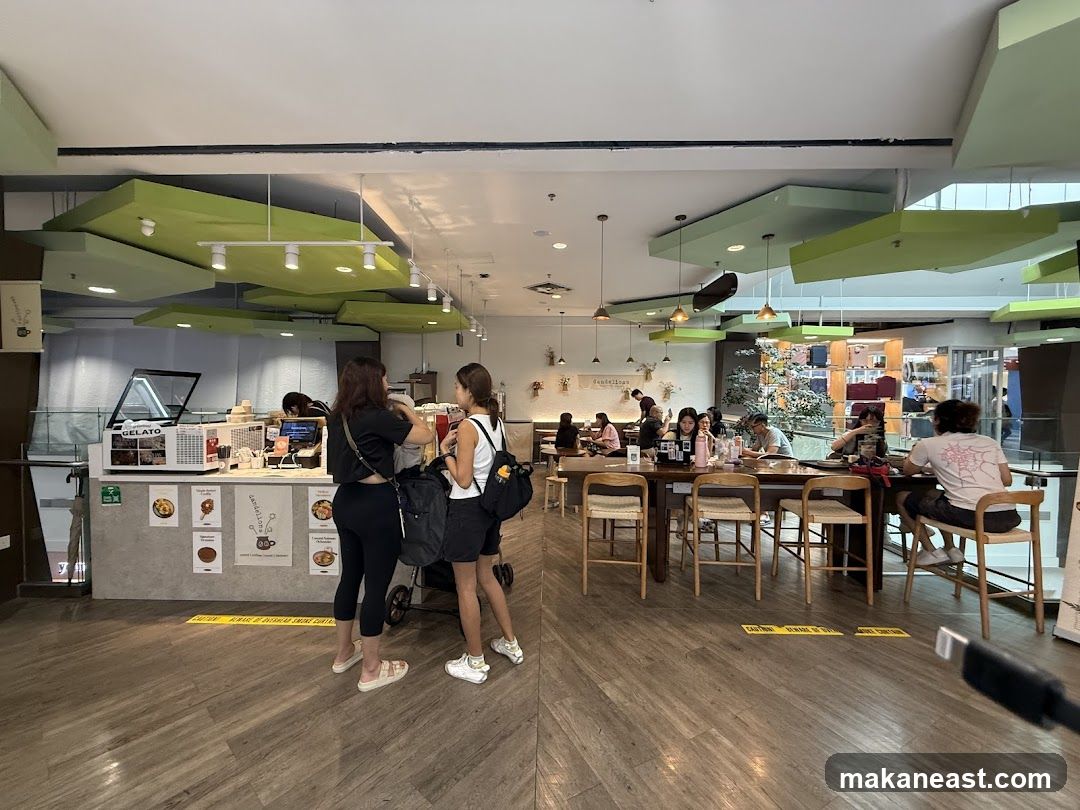 Interior of a cafe with gelato counter and seating area