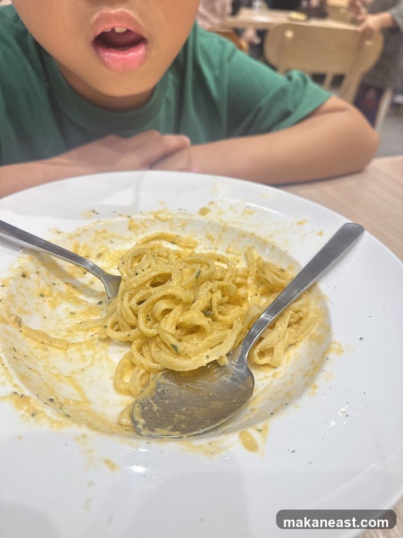 Child eating pasta