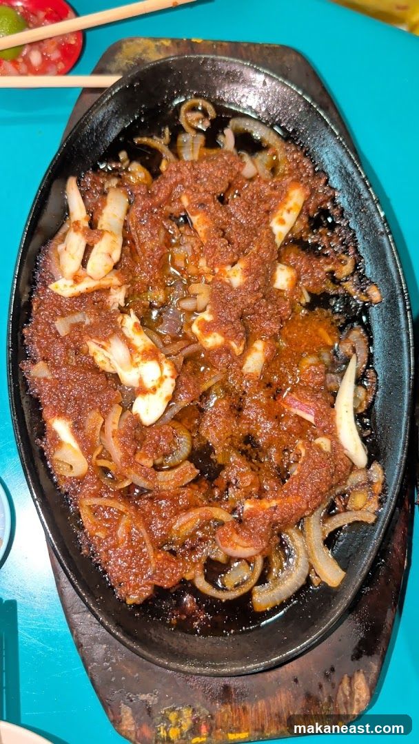 Sizzling Squid with Onions