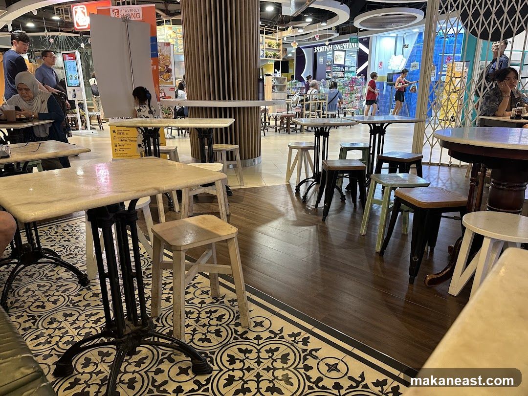 Indoor seating area with tables and chairs