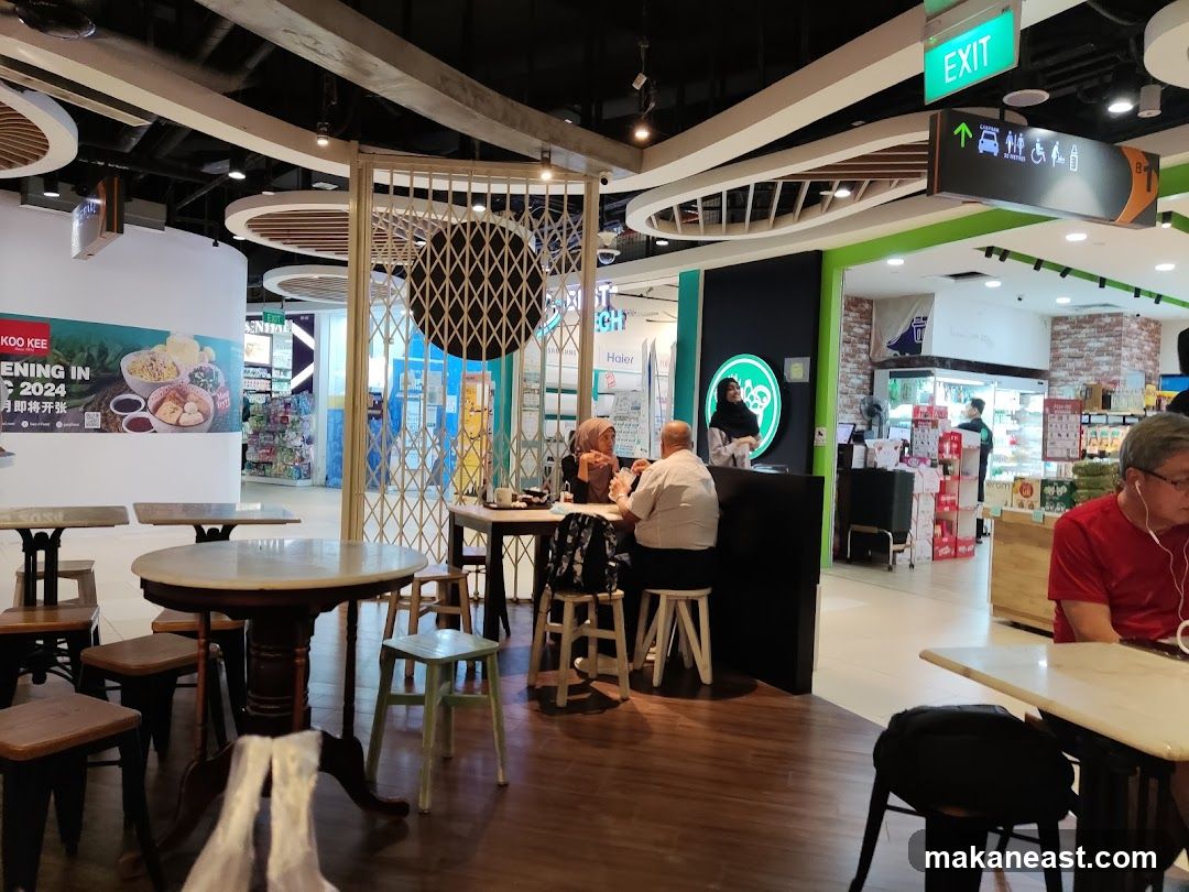 Food court interior with seating and a counter